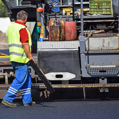 Construction worker at the road construction