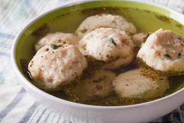 Bread dumplings with broth, close-up  on the table. horizontal
