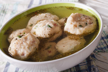 bread dumplings in a broth close up. horizontal
