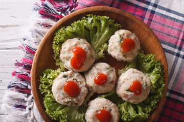 canederli with tomato sauce closeup on a plate. horizontal top view
