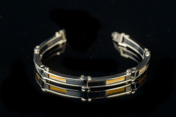 jewelry and bracelets on a black background
