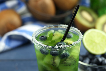 Kiwi and Blueberry cocktail on wooden background