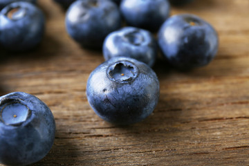 Fresh blueberries on wooden table, closeup