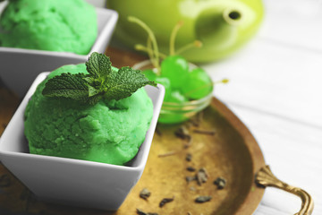 Homemade green tea ice-cream on light wooden background