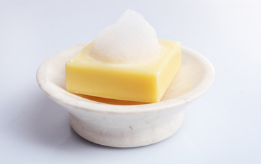 Soap with foam isolated on white
