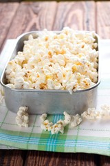 Aluminum square bowl full of salt popcorn