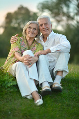 Fototapeta premium Elderly couple on nature at summer