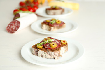 Tasty sandwiches on plates, close up