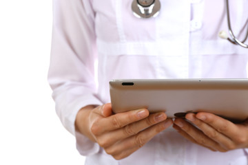 Female doctor working on digital tablet isolated on white
