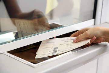 Woman buying tickets at box office