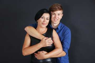 Portrait of mother and her son on dark background