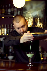 Bartender making cocktail