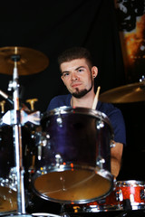 Drummer on dark background