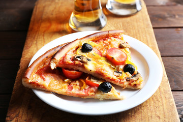 Sliced pizza on cutting board