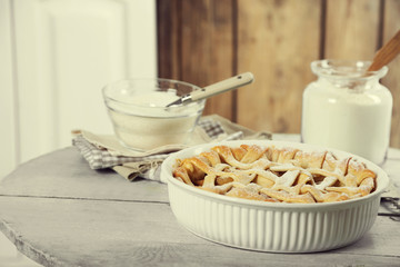 Homemade apple pie on wooden background