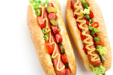 A pair of fresh hot dogs isolated on white
