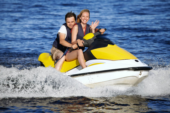 Couple Riding Jet Ski