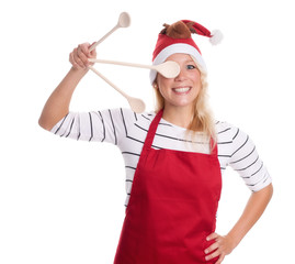 Weihnachtsfrau hält sich einen Kochlöffel vor die Augen