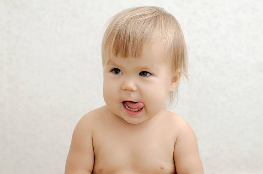 Cheerful baby sticking tongue