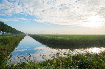 Canal through a rural landscape in autumn 