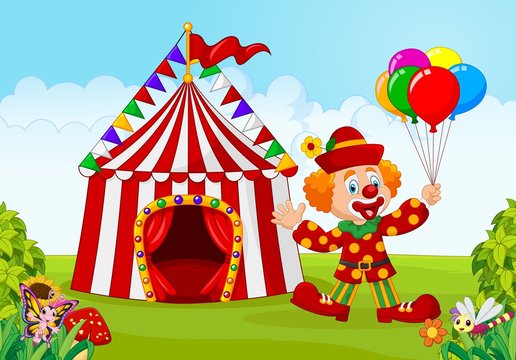 Circus tent with clown holding balloon in the green park