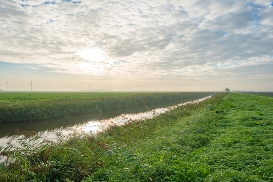 Canal through a rural landscape in autumn
