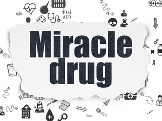 Healthcare concept: Miracle Drug on Torn Paper background