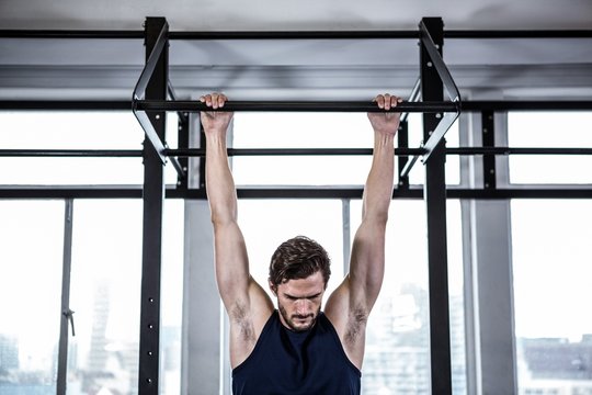 Fit man doing pull ups 