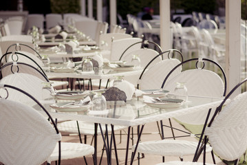 Empty tables at an outdoor restaurant