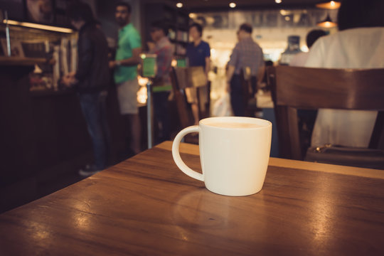 Cup of coffee on table in cafe , Coffee Shop Blurred background
