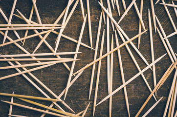 Many toothpicks lying in pile facing different directions on a
