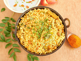 Rice and eggplant pilaf in a wok. © Greentree