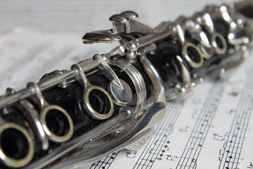 Clarinet. Old clarinet on the old grunge music notes