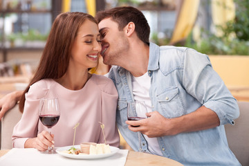 Attractive man and woman are relaxing in cafe