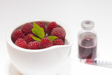 ripe raspberries in a bowl
