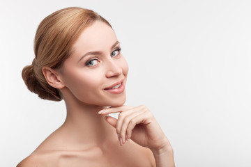 Attractive young girl is caring of her skin