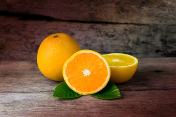 Orange on a wooden table. Selective focus.