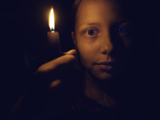 Teen girl with a candle