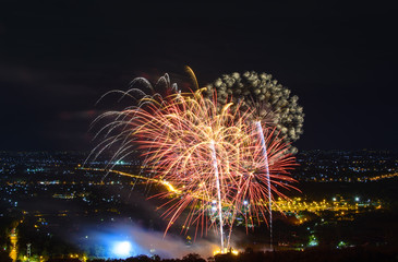 Fireworks on night city background