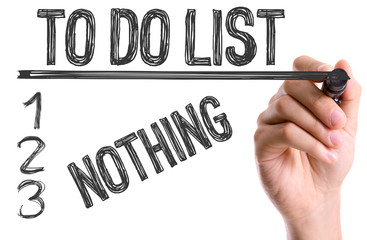 Hand with marker writing: To Do List: Nothing