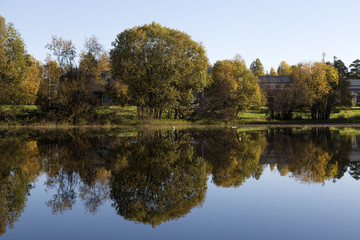 An autumn view with reflections from the trees in the lake