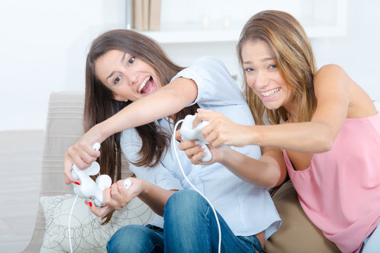 Two girls playing computer game