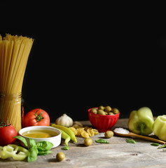 Italian and Mediterranean food ingredients on old wooden backgro