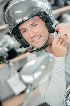 Trying on a motorcycle helmet