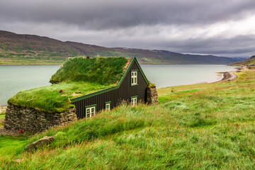 Cottage covered with grass on the roof in Iceland