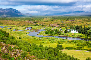 Green valley with the river and the mountains in Iceland