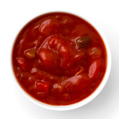 Round white bowl of tortilla tomato salsa dip isolated from abov
