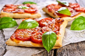 Pie with tomatoes, cheese and Basil