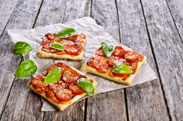 Pie with tomatoes, cheese and Basil