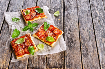 Pie with tomatoes, cheese and Basil